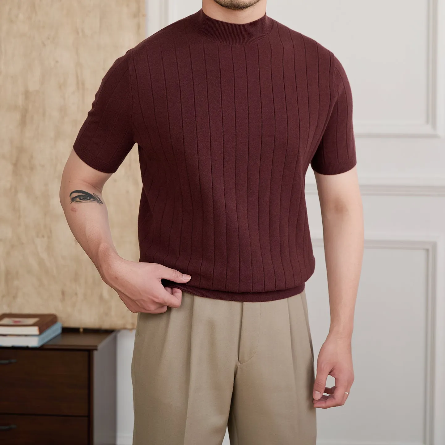 Half turtleneck wool blend knitted short sleeve T-shirt in chocolate colour, front view, on white background.