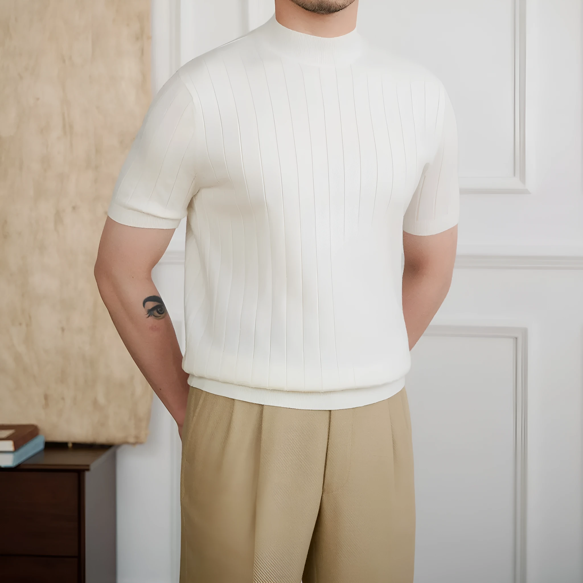 Half turtleneck wool blend knitted short sleeve T-shirt in chocolate colour, front view, on white background.