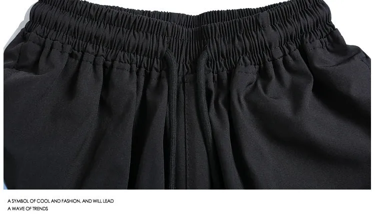 Black quick-drying sports shorts with elastic waistband and loose straight-leg design