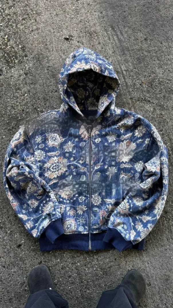 Men's loose blue hooded zip coat with long sleeves on a hanger