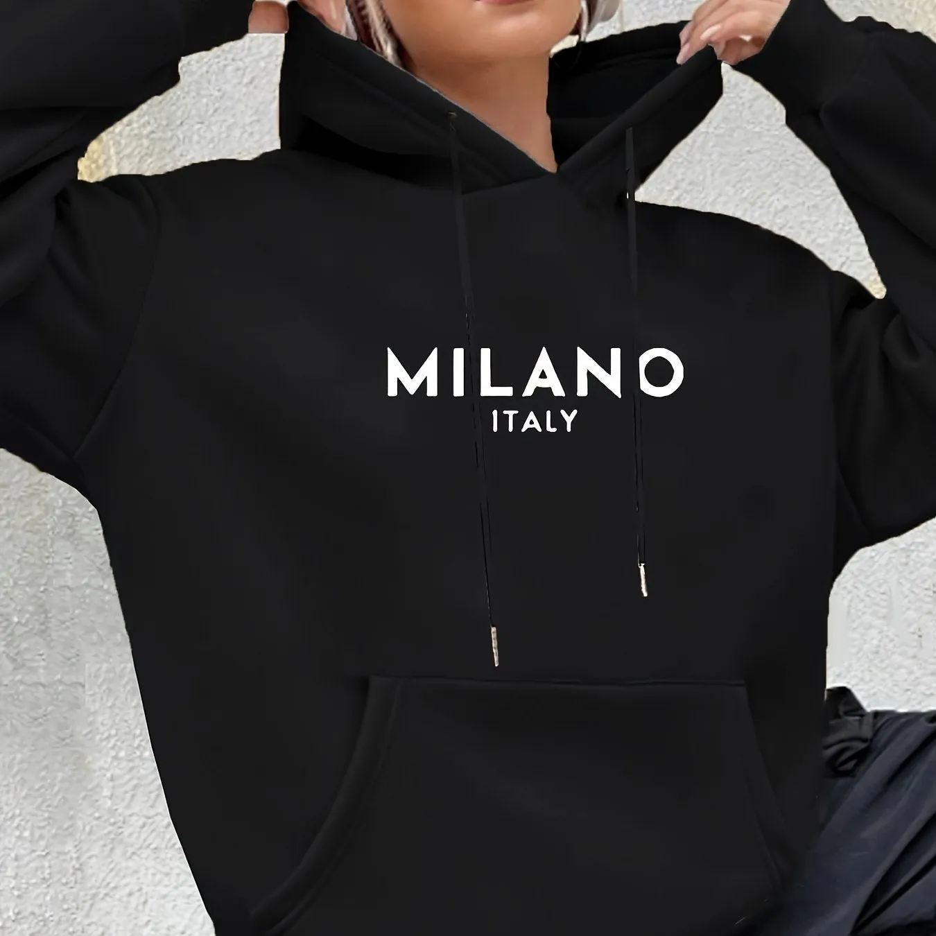 Casual long sleeved printed kangaroo pocket hoodie in black, loose fit, front view