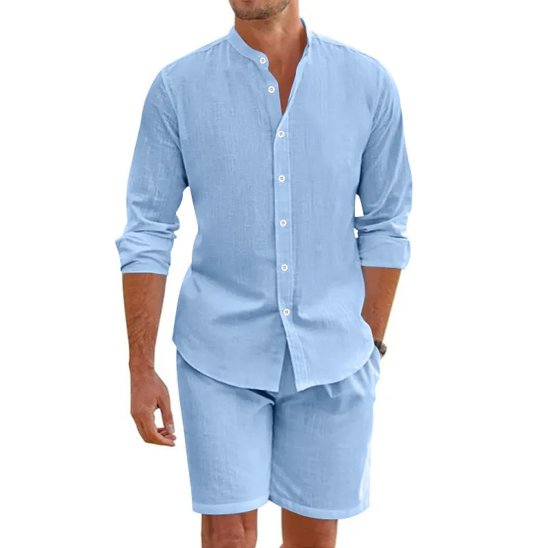 Men's dark grey linen blend summer suit with button-down short sleeve shirt and drawstring shorts.