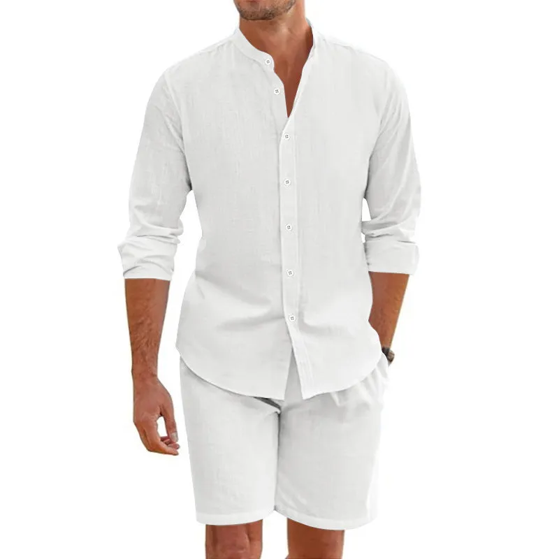 Men's dark grey linen blend summer suit with button-down short sleeve shirt and drawstring shorts.