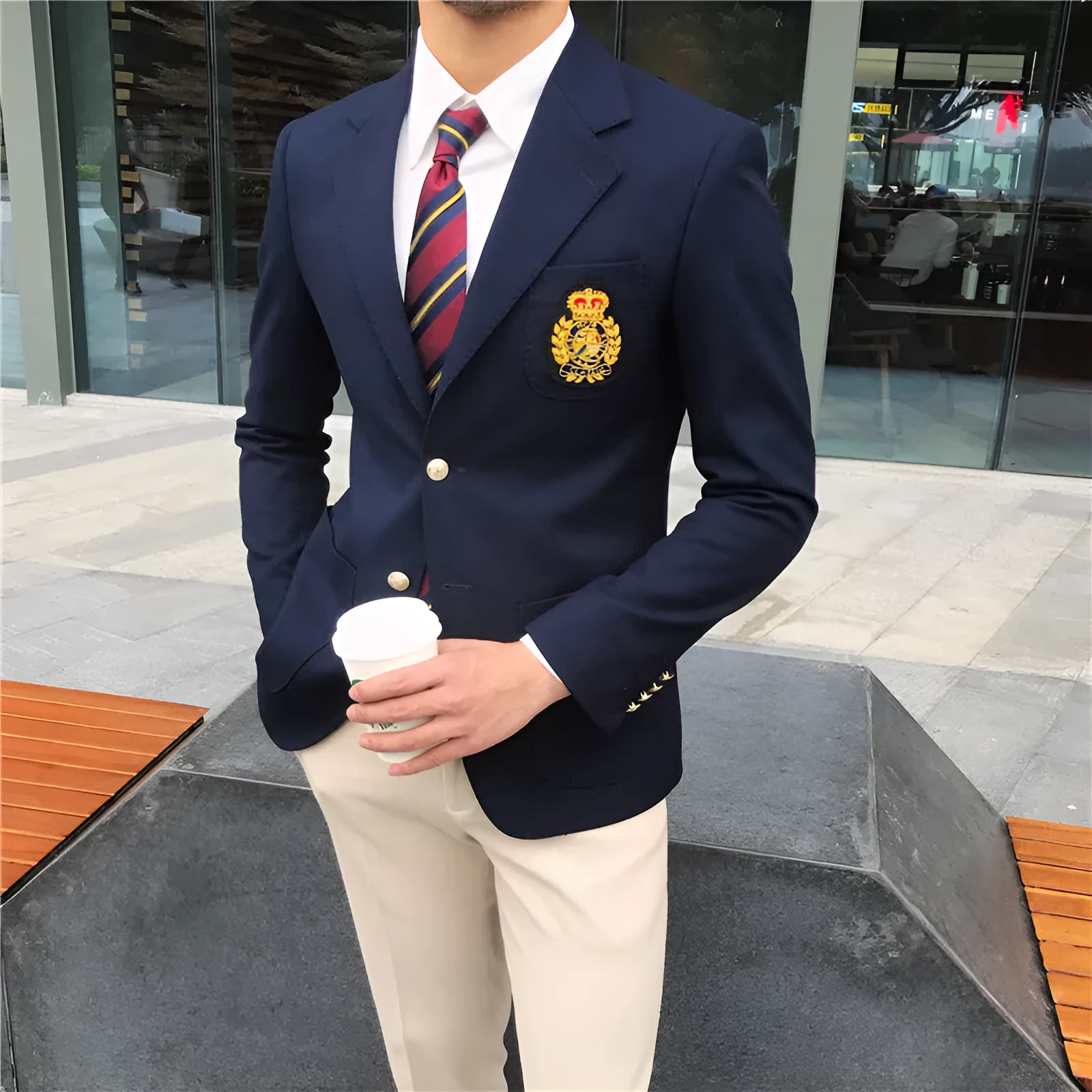 Men's dark blue suit jacket with flat lapel collar and two-button front on display