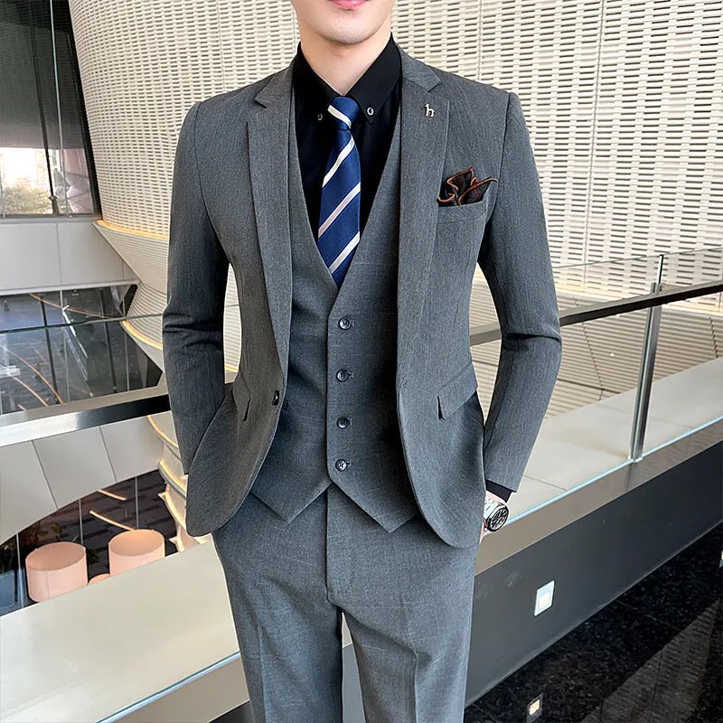 Slim fit men's business suit in black or dark grey with cotton blend fabric construction