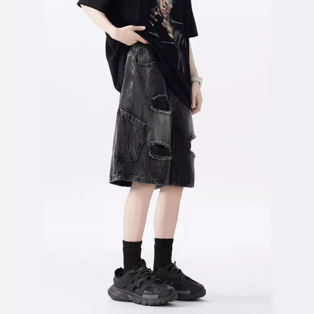 Retro loose-fit ripped denim shorts in washed black or blue with distressed detailing