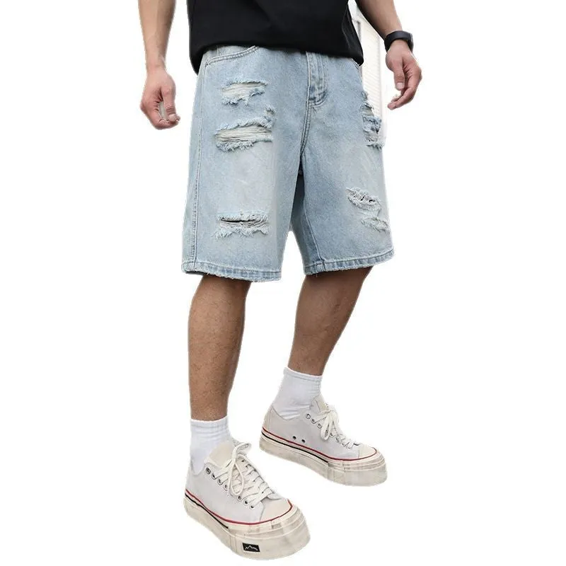 Men's light blue ripped denim shorts with a loose, straight leg fit on a plain background.