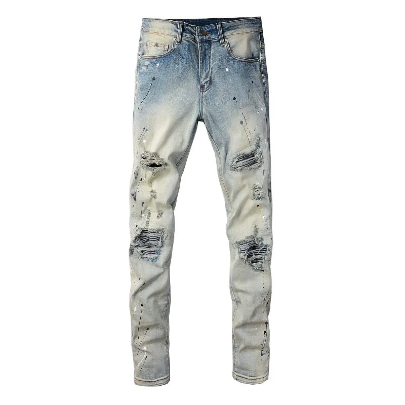 Men's blue light coloured paint splashing ink making old washed denim jeans with small straight leg and zip fly