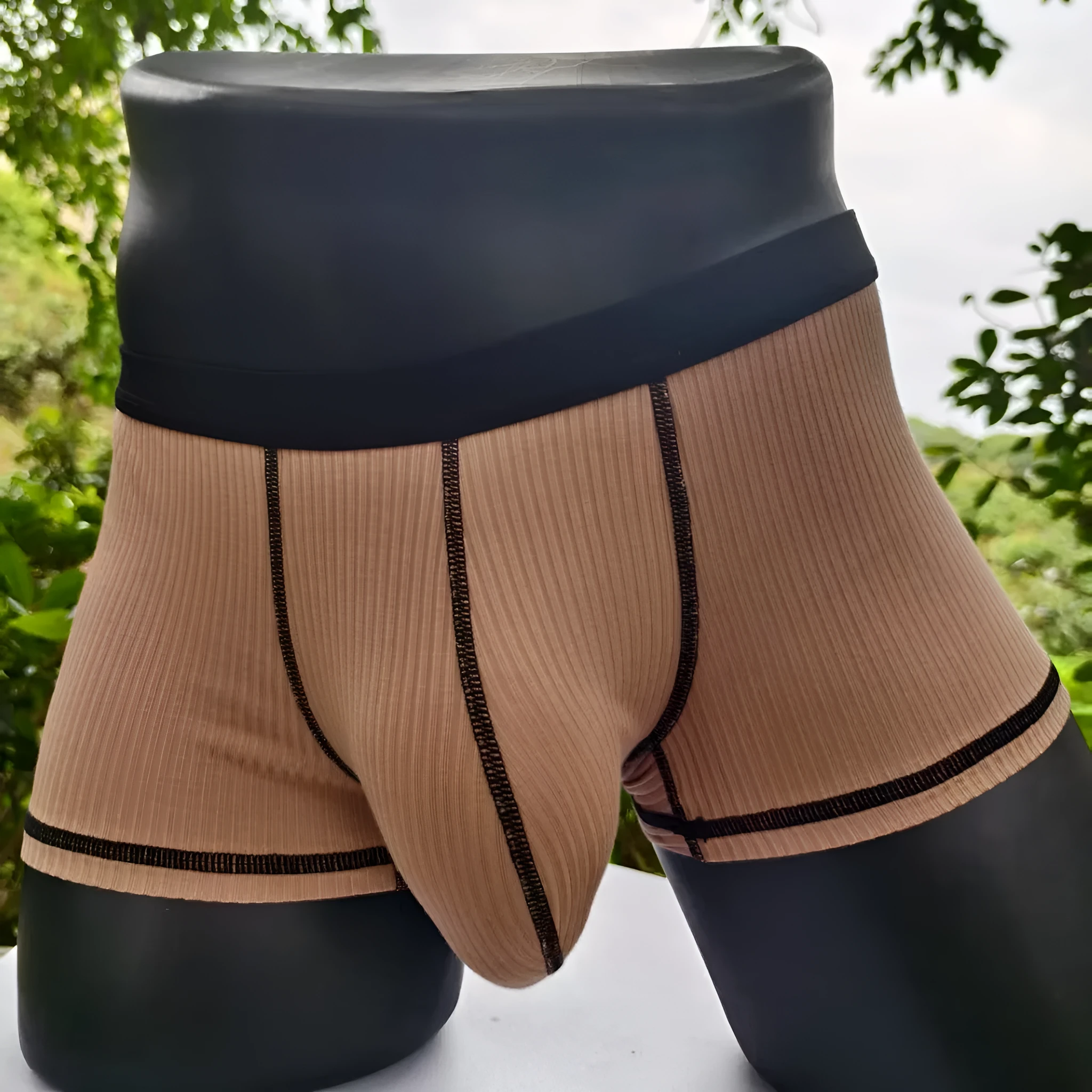 Men's solid colour breathable boxer shorts in Army Green, shown laid flat to display thin fabric and cut.
