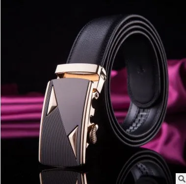 Men's two-layer cowhide belt with gold alloy automatic buckle on a flat surface