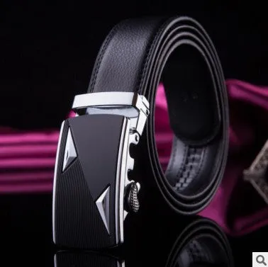 Men's two-layer cowhide belt with gold alloy automatic buckle on a flat surface