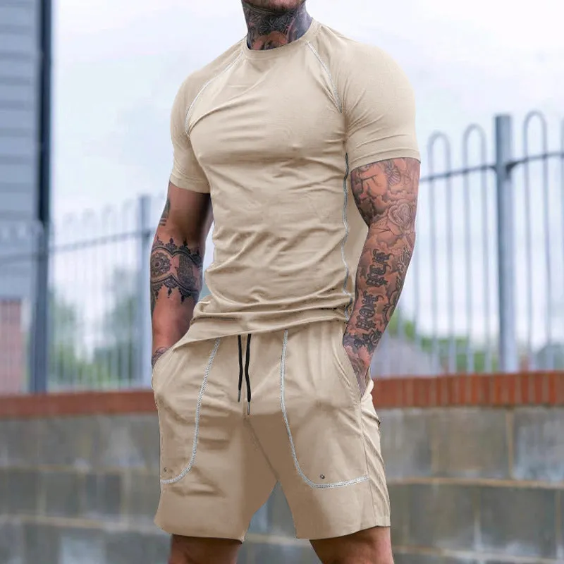 Men's sports running suit with short-sleeve T-shirt and shorts in black colour shown on model