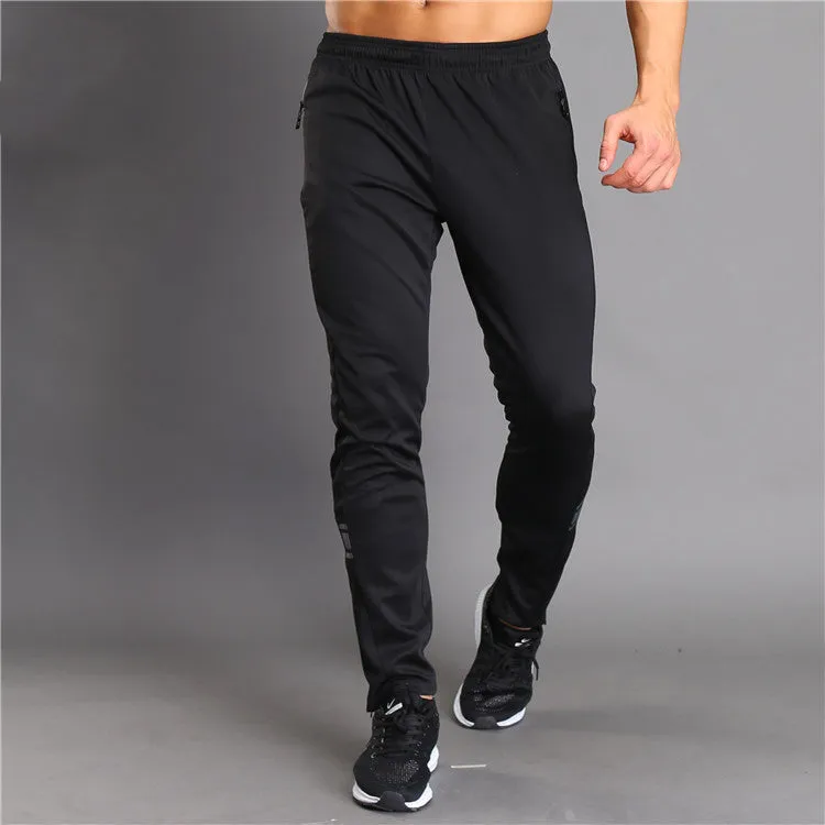 Black running fitness trousers with colour-changing reflective print, slim fit, zippered pockets, polyester fabric