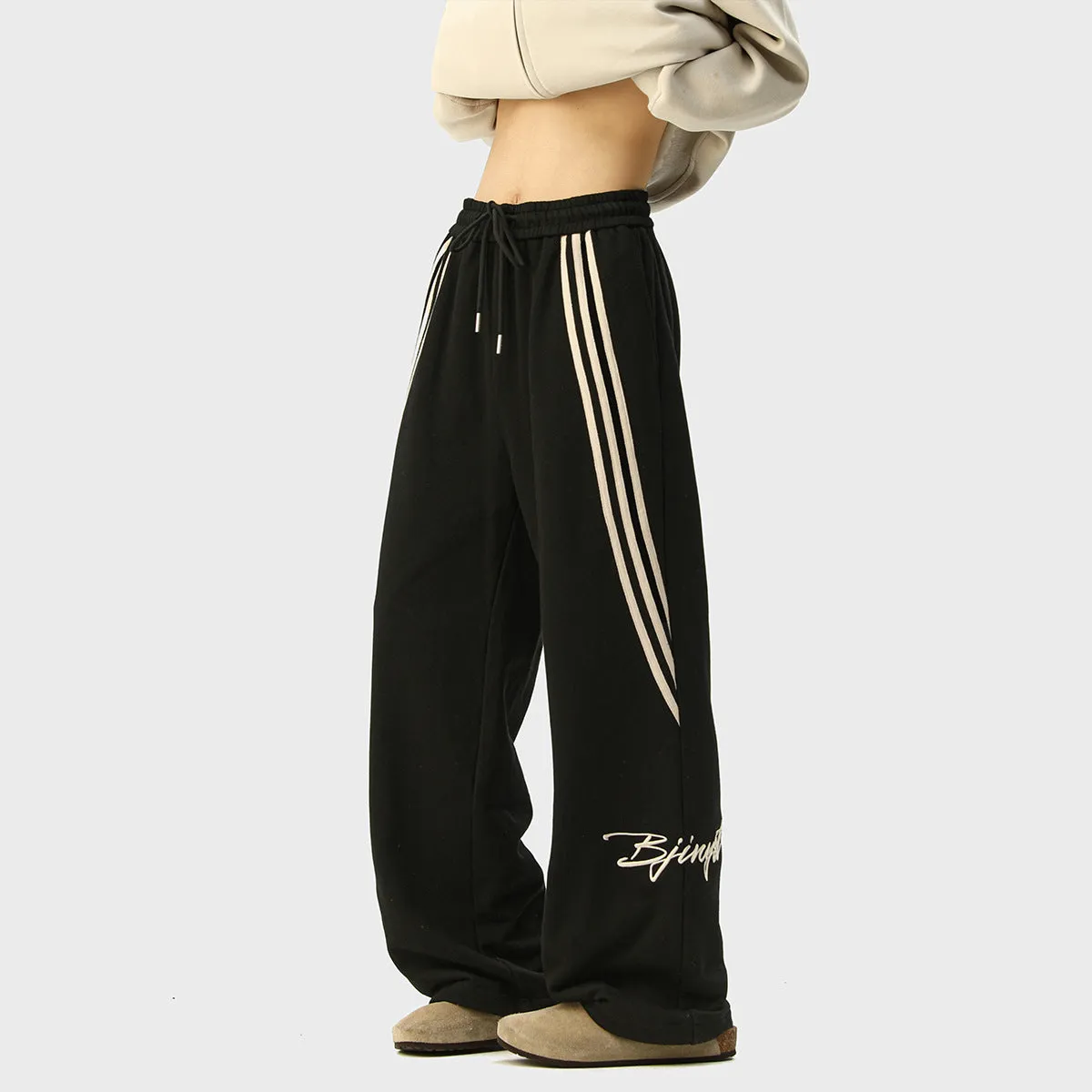 Men's striped loose straight-leg casual pants in Black, front view, showing wrinkle-free fabric and straight leg cut