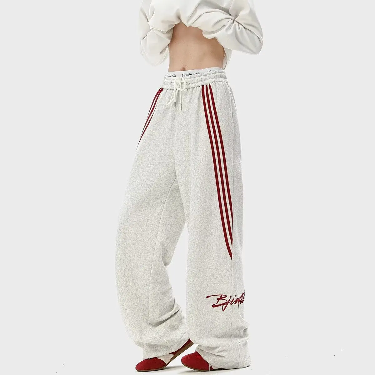 Men's striped loose straight-leg casual pants in Black, front view, showing wrinkle-free fabric and straight leg cut
