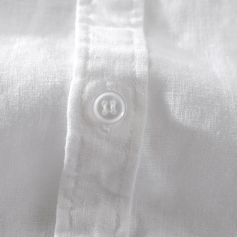 Men's solid colour short sleeve linen blend shirt on a hanger, showing loose fit.