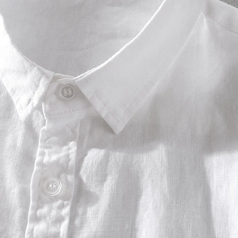 Men's solid colour short sleeve linen blend shirt on a hanger, showing loose fit.