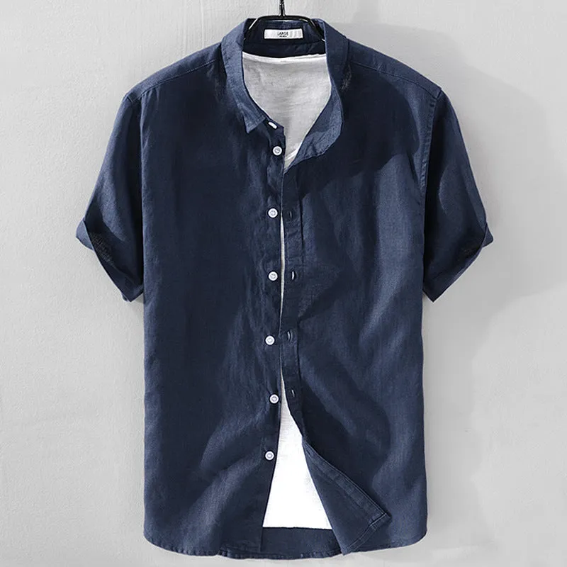 Men's solid colour short sleeve linen blend shirt on a hanger, showing loose fit.