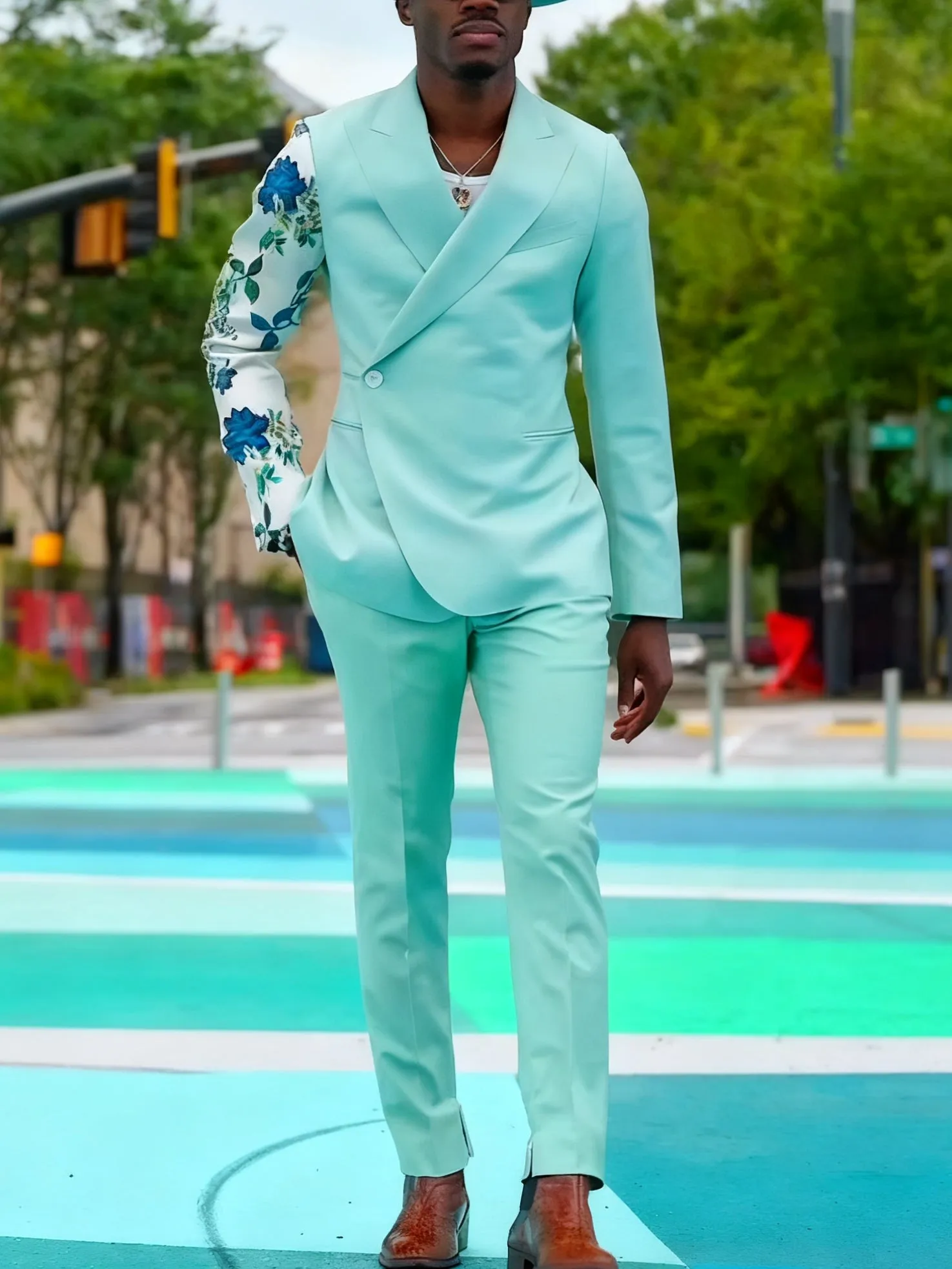 Mint green women's suit with double-breasted blazer and floral print sleeves, paired with ankle-length pants