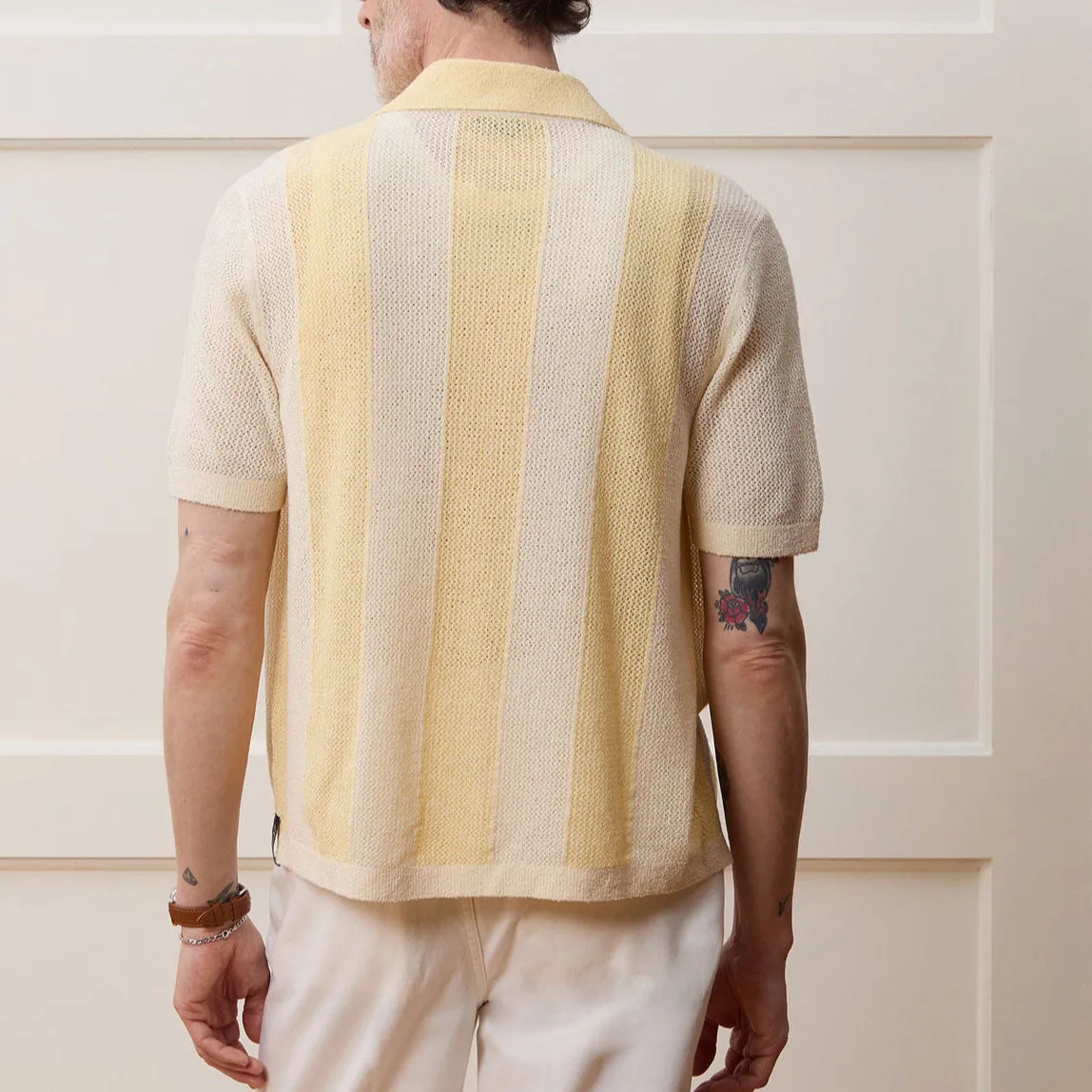 Yellow casual polo shirt with hollow-out asymmetric design and short sleeves in Tencel fabric