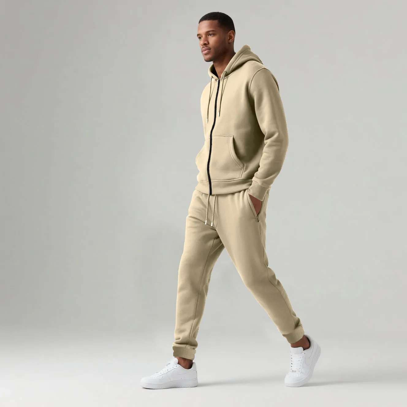 Men's solid colour long-sleeve hooded sportswear set with matching jacket and pants in black cotton polyester blend