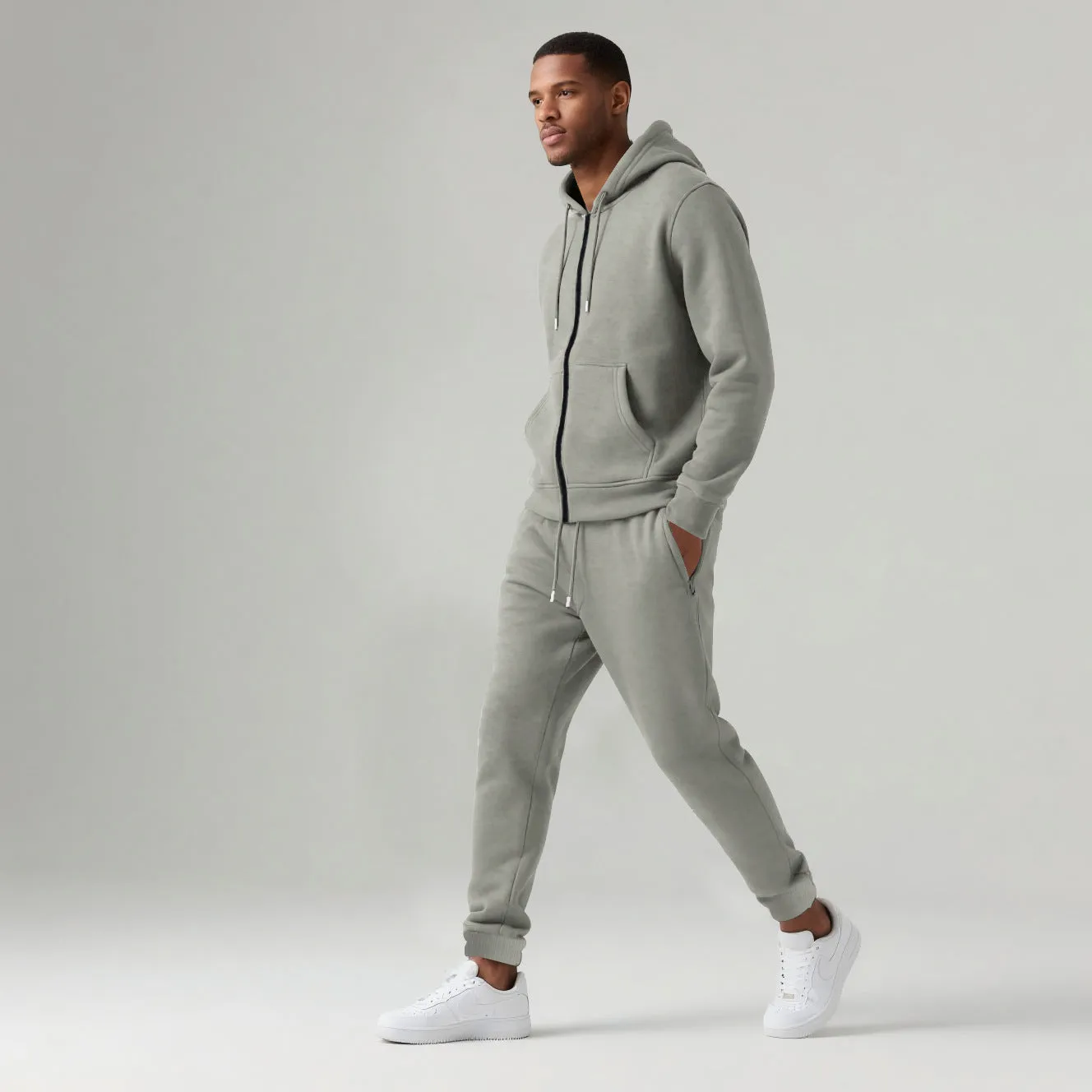 Men's solid colour long-sleeve hooded sportswear set with matching jacket and pants in black cotton polyester blend