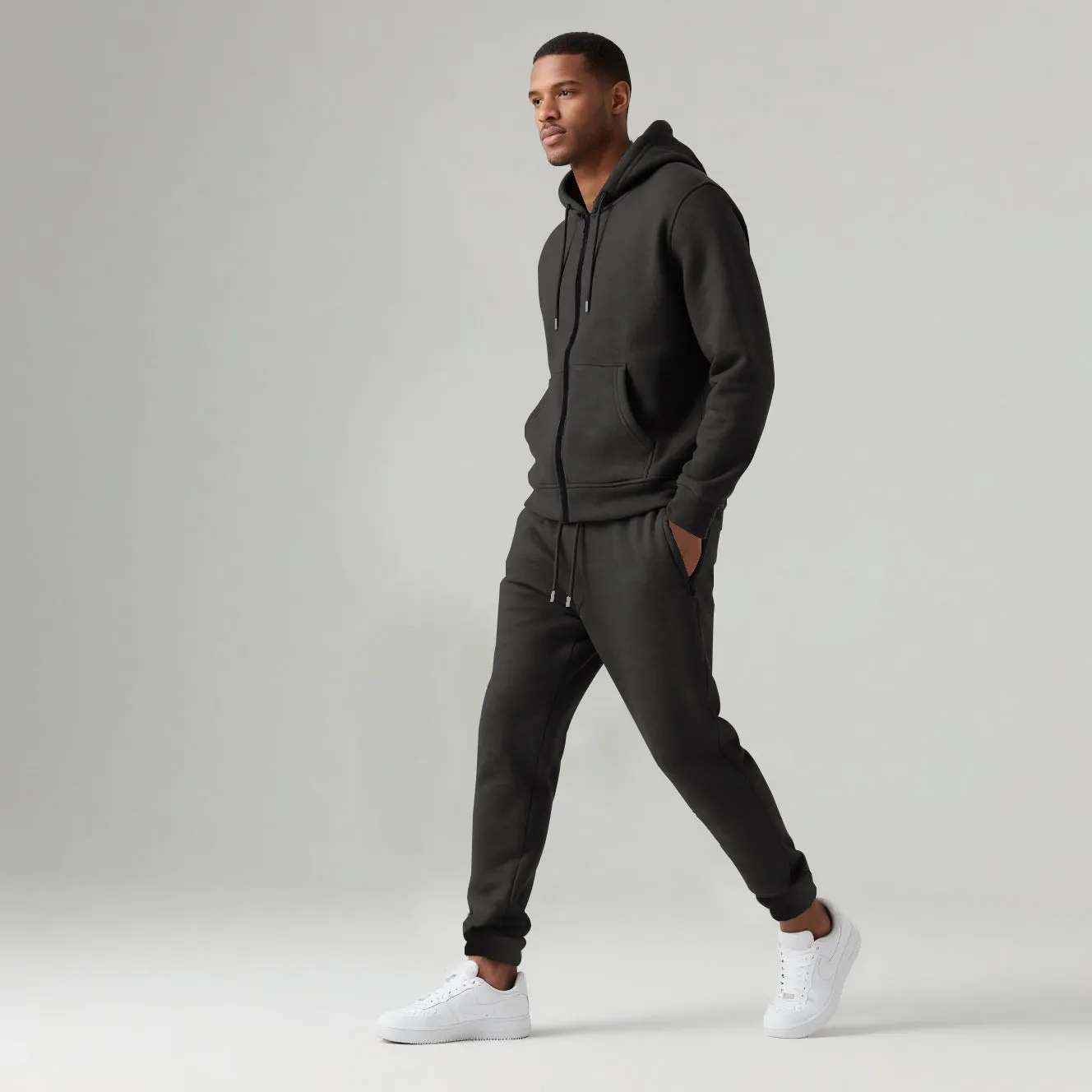 Men's solid colour long-sleeve hooded sportswear set with matching jacket and pants in black cotton polyester blend