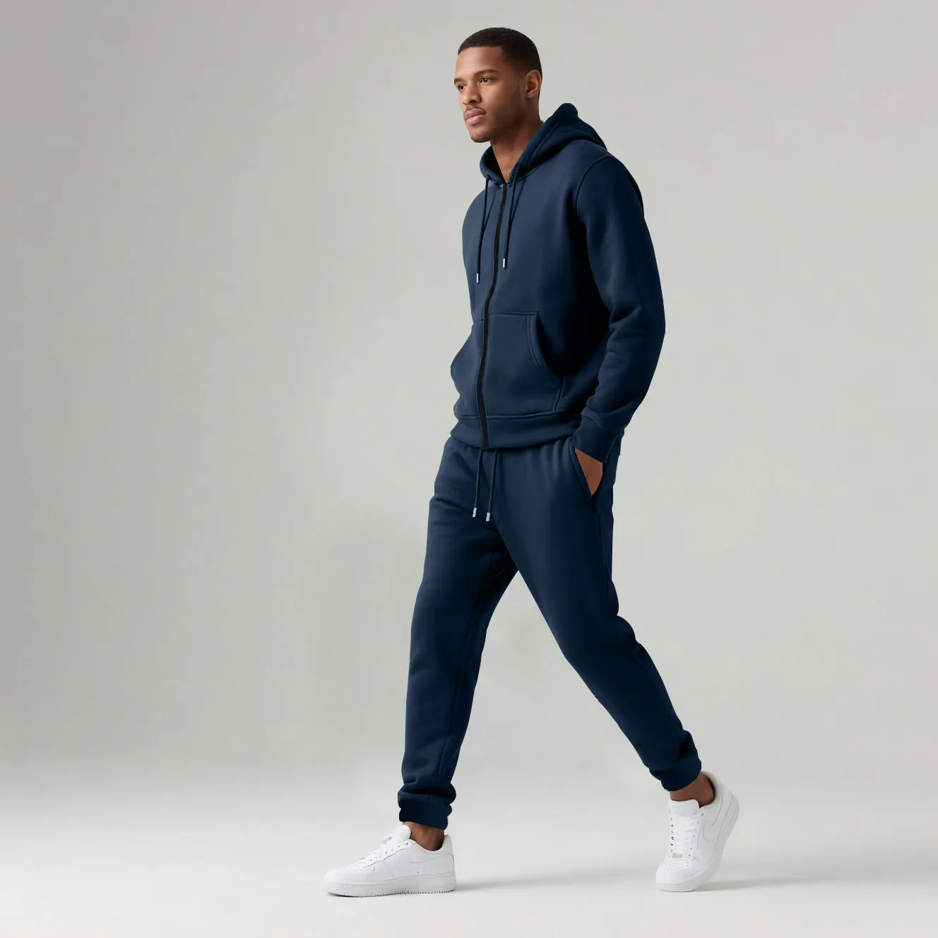 Men's solid colour long-sleeve hooded sportswear set with matching jacket and pants in black cotton polyester blend