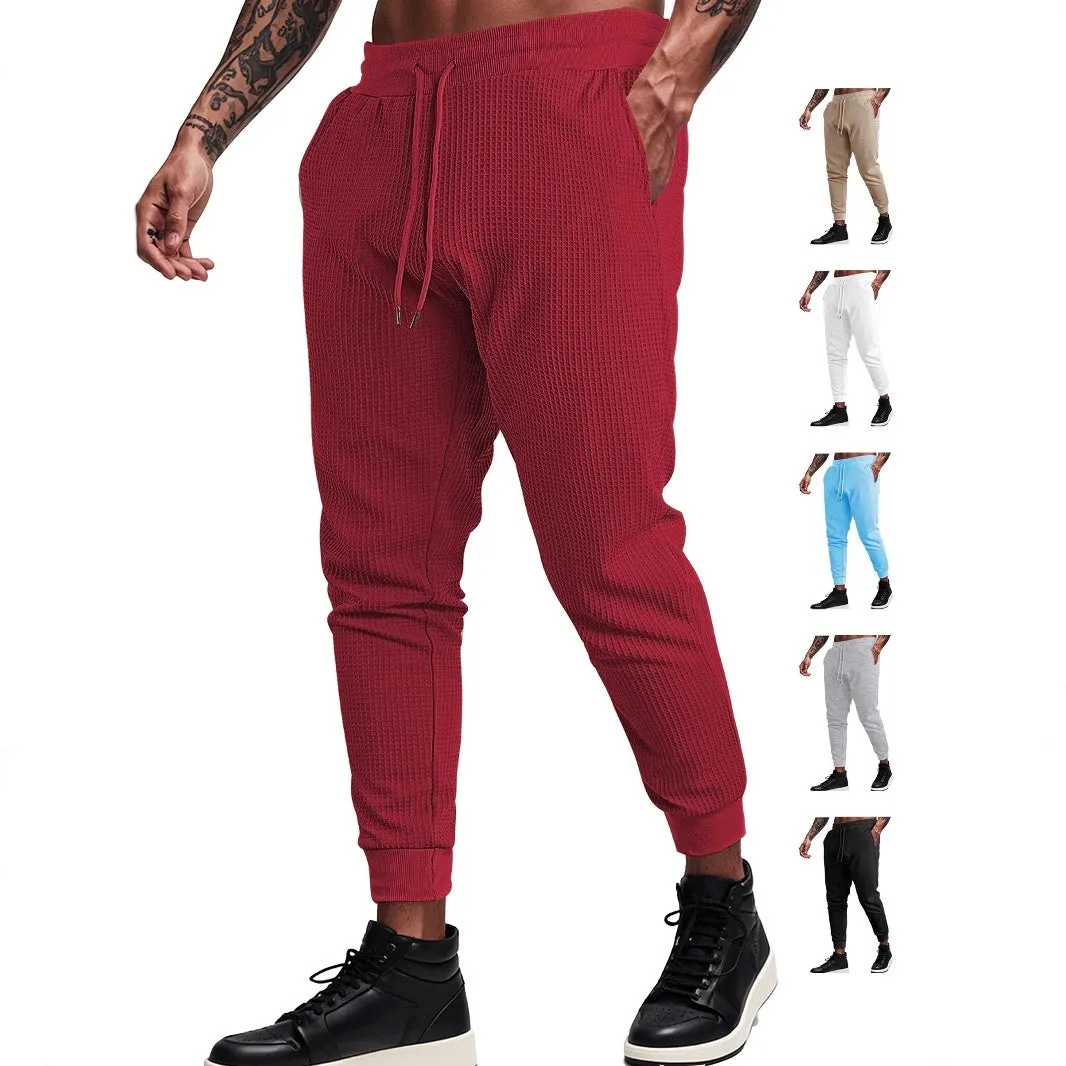 Men's casual loose solid colour drawstring pants in waffle knit polyester, front view