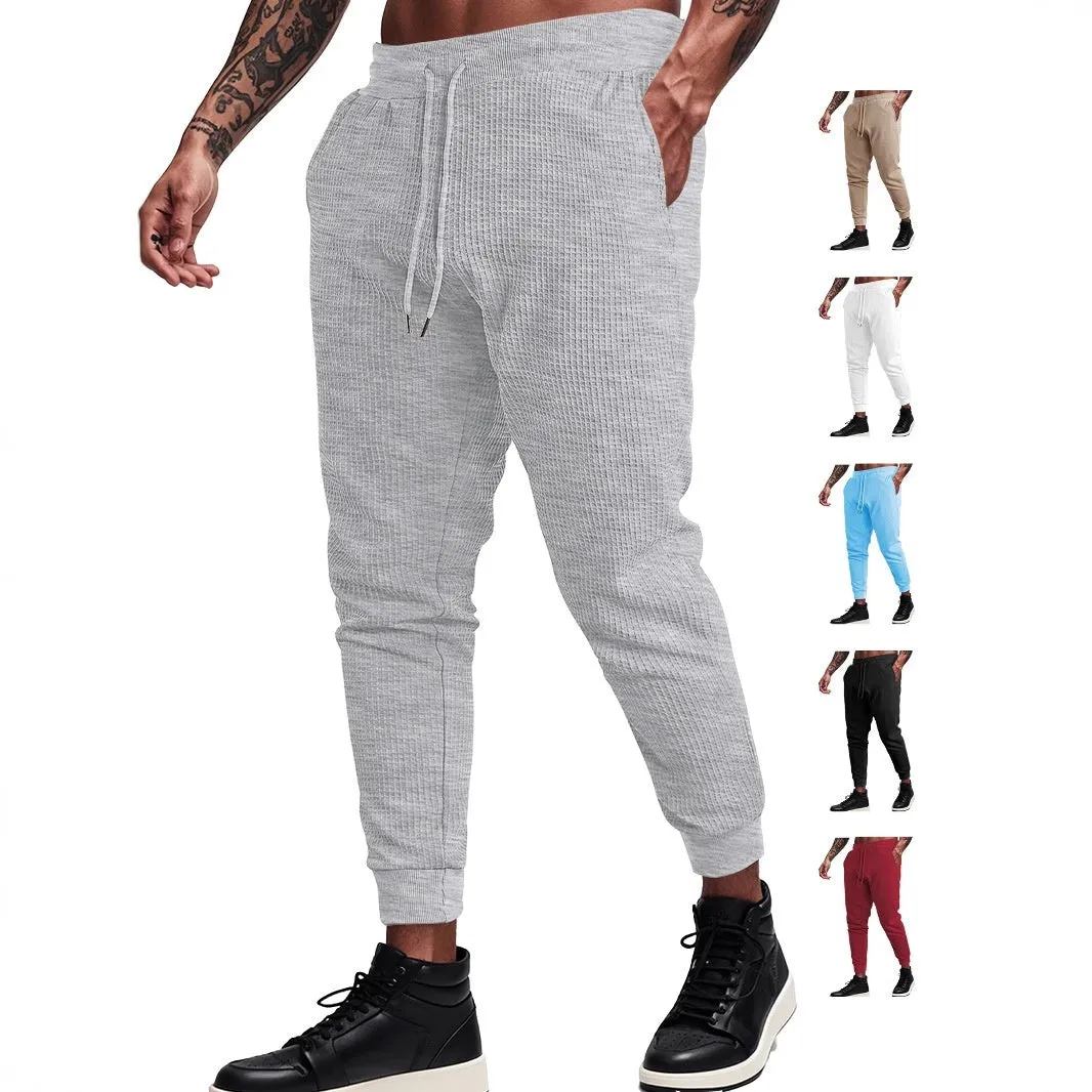 Men's casual loose solid colour drawstring pants in waffle knit polyester, front view