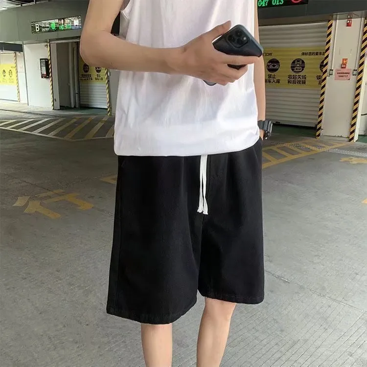 Men's loose straight casual cotton denim shorts in dark blue, front view