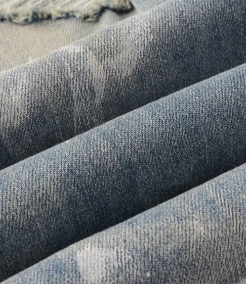 Men's patch slimming perforated leggings in light blue denim cotton, shown on model, multiple sizes available
