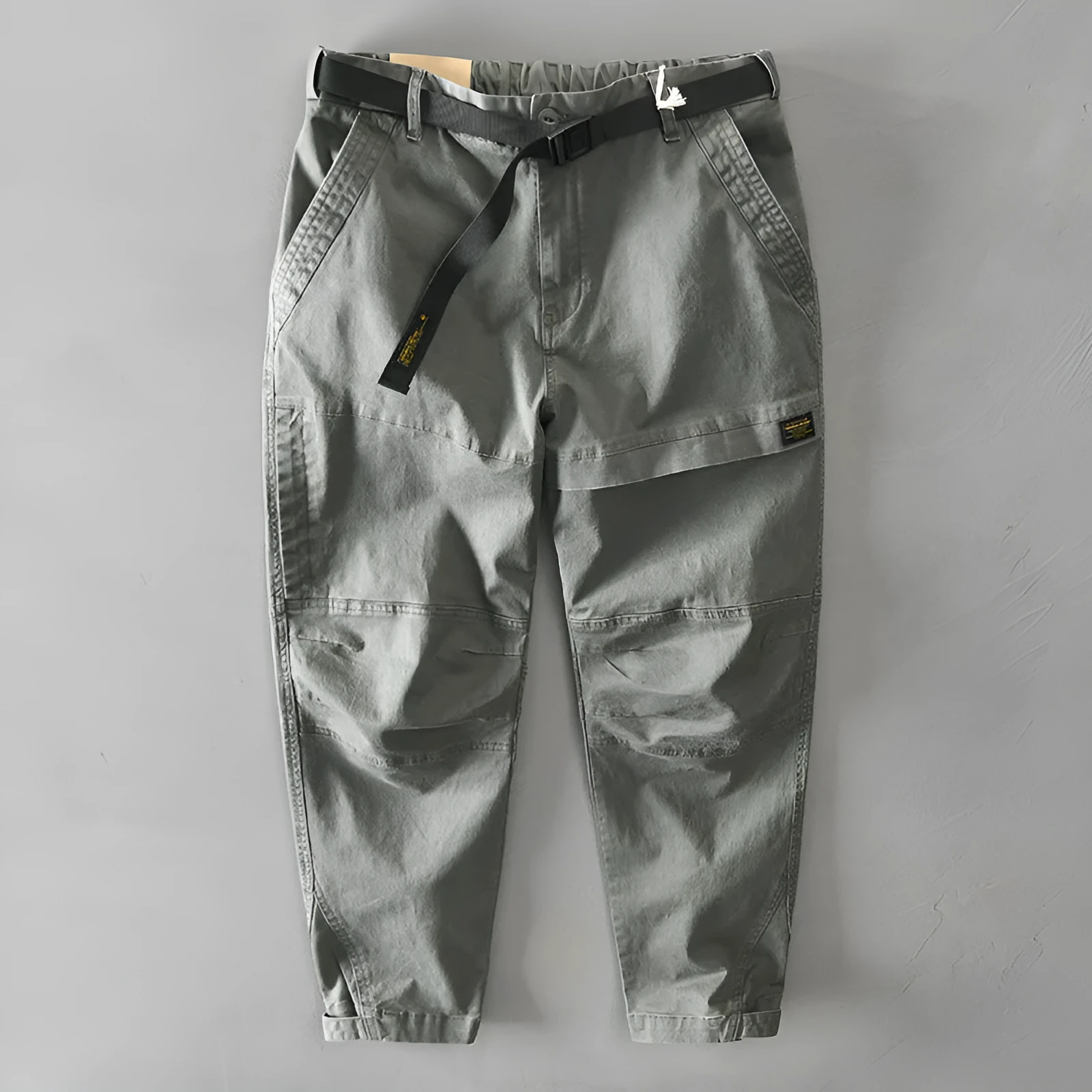 Man wearing khaki cotton elastic casual Japanese overalls with a loose fit.