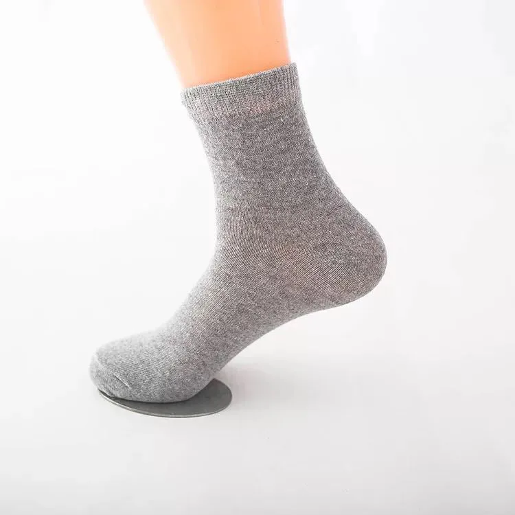 Black, white, and grey boat socks and medium tube socks from Degner in cotton blend fabric