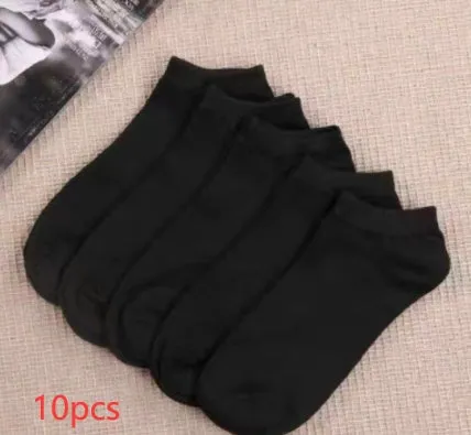 Black, white, and grey boat socks and medium tube socks from Degner in cotton blend fabric