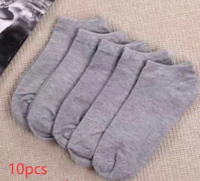 Black, white, and grey boat socks and medium tube socks from Degner in cotton blend fabric