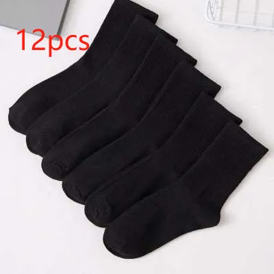 Black, white, and grey boat socks and medium tube socks from Degner in cotton blend fabric