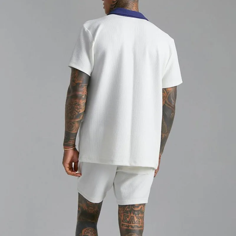 Men's two-piece suit in polyester cloth with printed design, available in black or white