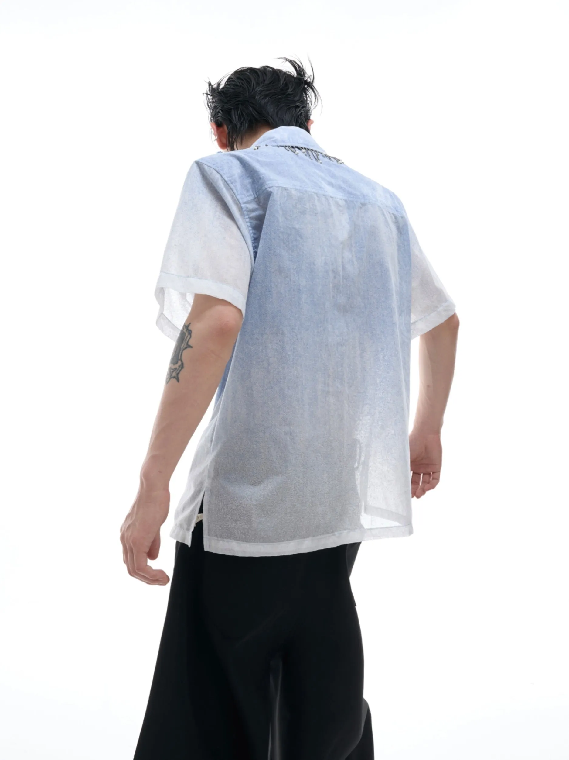 Blue and white gradient loose fit short sleeve shirt on a hanger