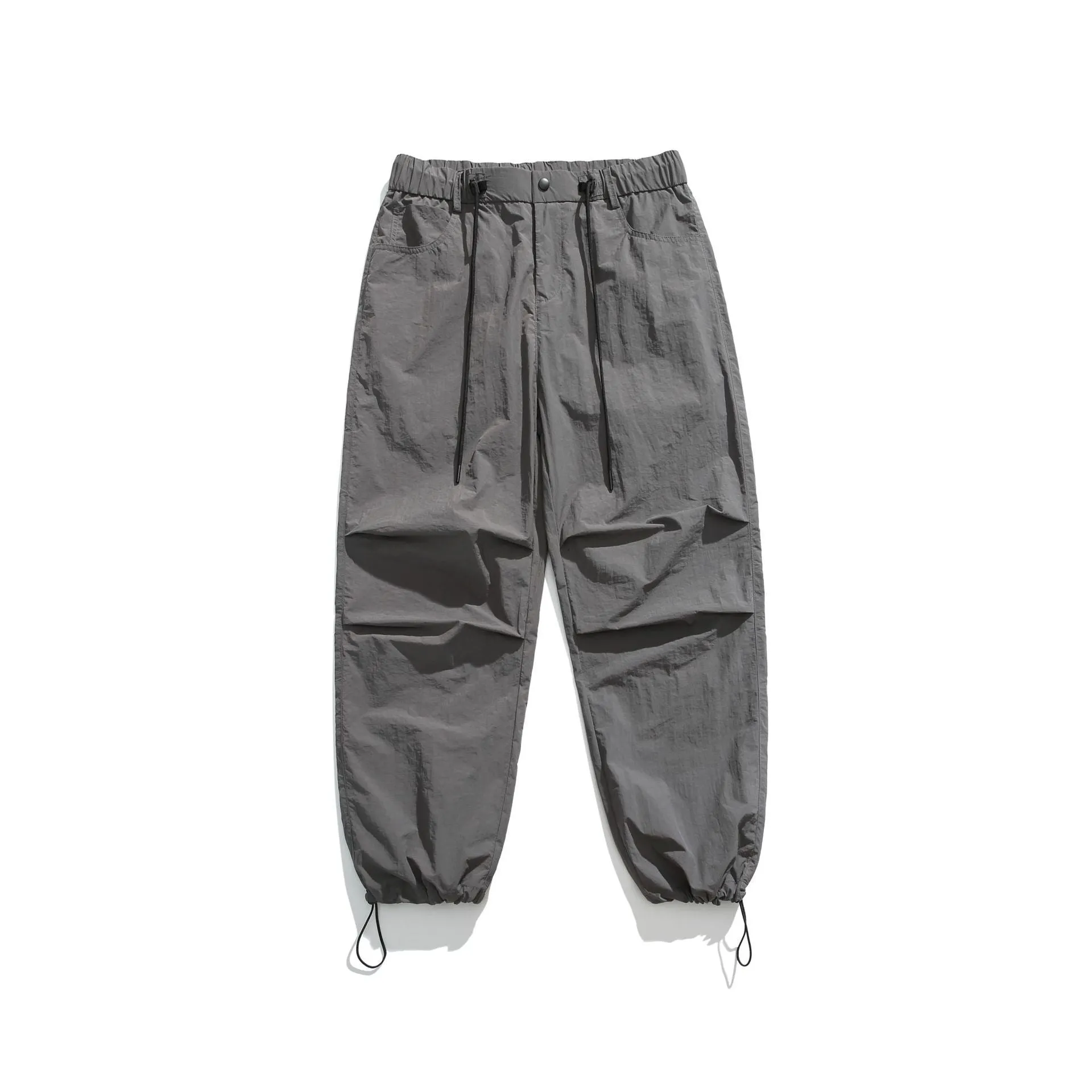 Men's loose straight-leg casual trousers in thin ice silk nylon fabric, shown in apricot colour.