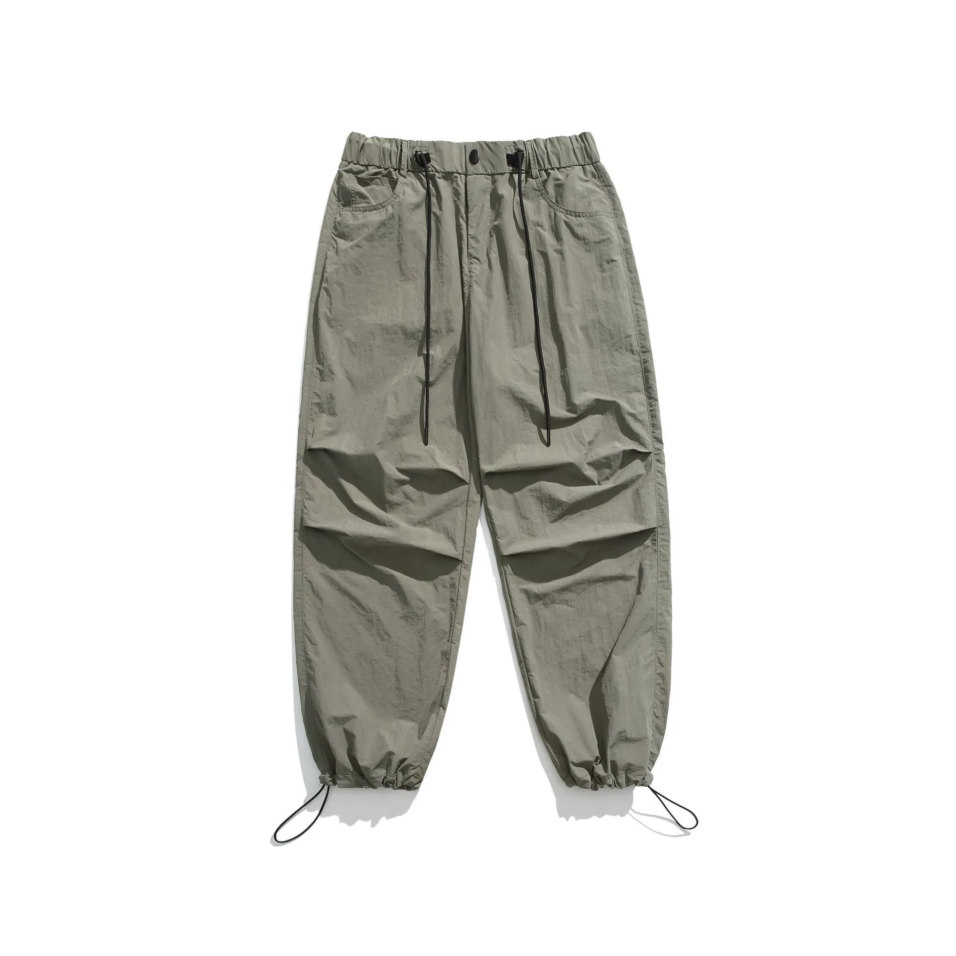 Men's loose straight-leg casual trousers in thin ice silk nylon fabric, shown in apricot colour.