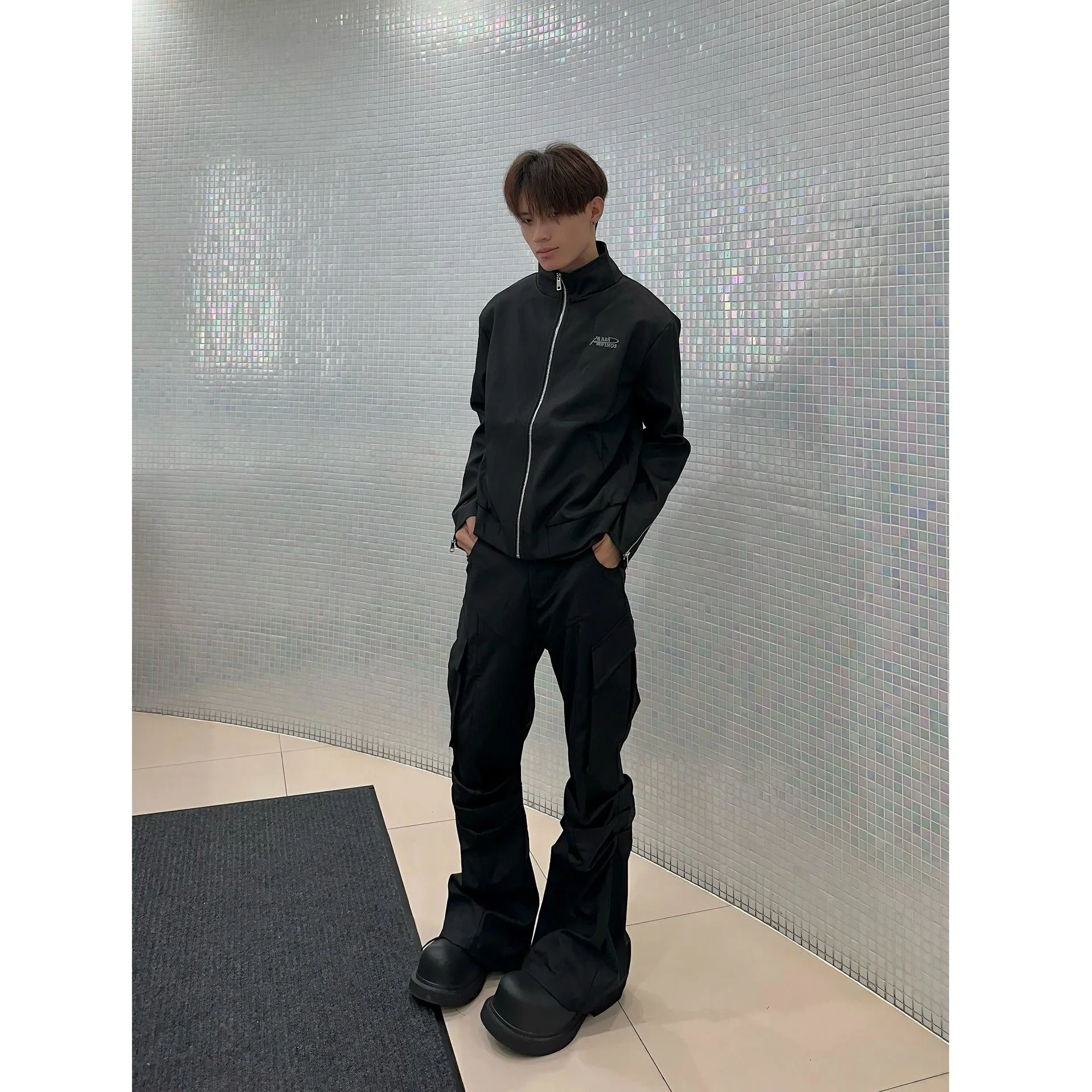Men's black cargo trousers with large side pockets, straight-leg cut, on a plain background