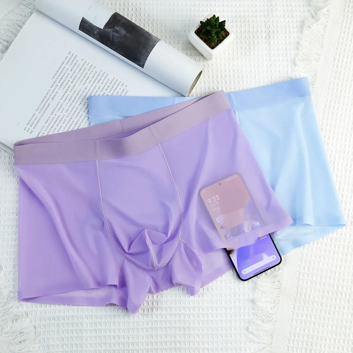 Ultra-thin Ice Silk seamless boxer briefs in white, shown flat.
