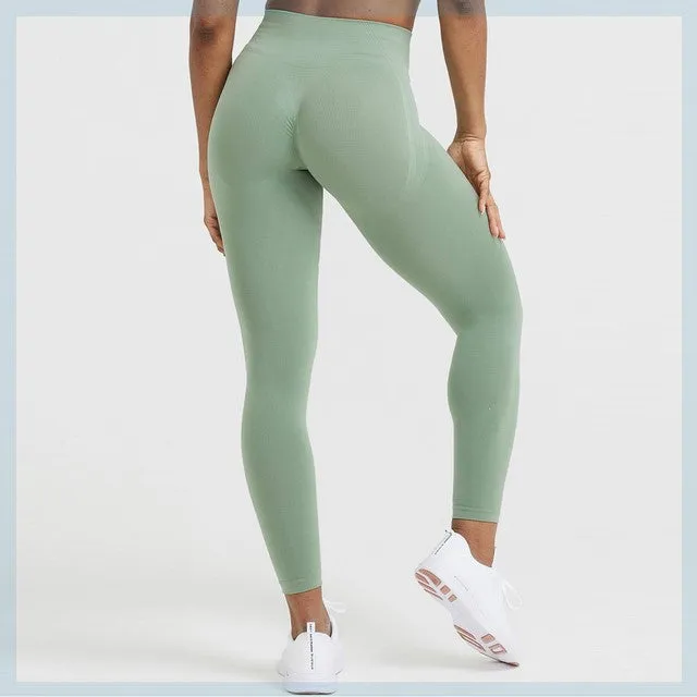 Women's seamless scrunch butt leggings in straight-leg style, available in Black, coal, rosewood, midnight, evergreen, and sage colours