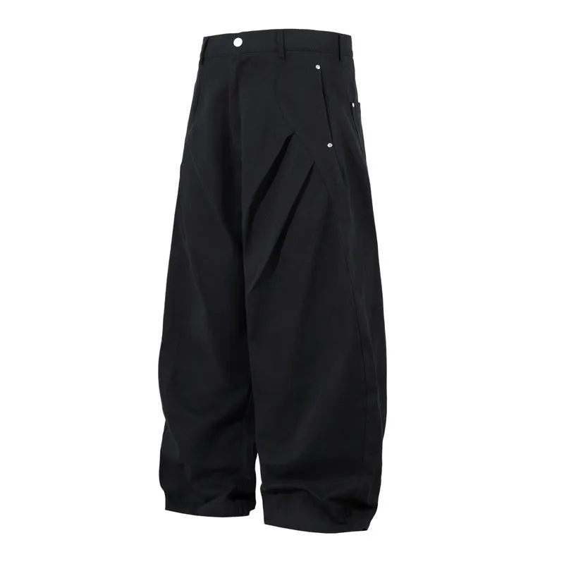 Black men's pleated casual trousers with a loose wide-leg fit on a hanger