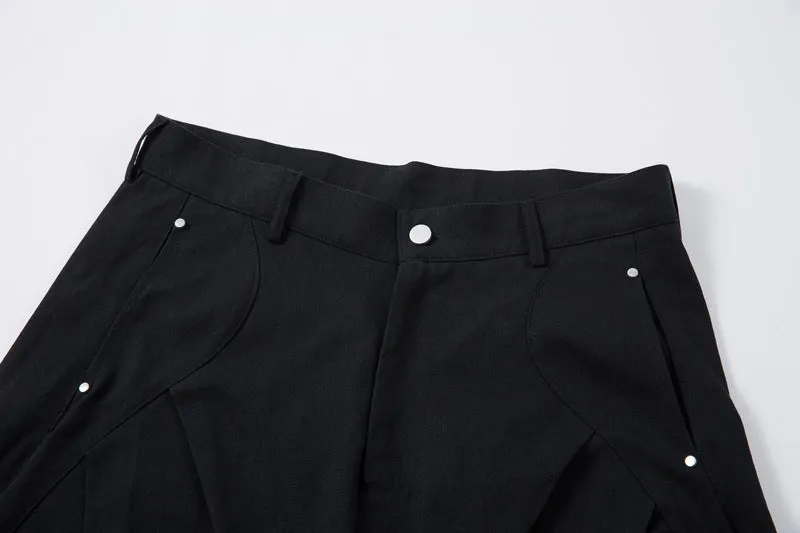 Black men's pleated casual trousers with a loose wide-leg fit on a hanger
