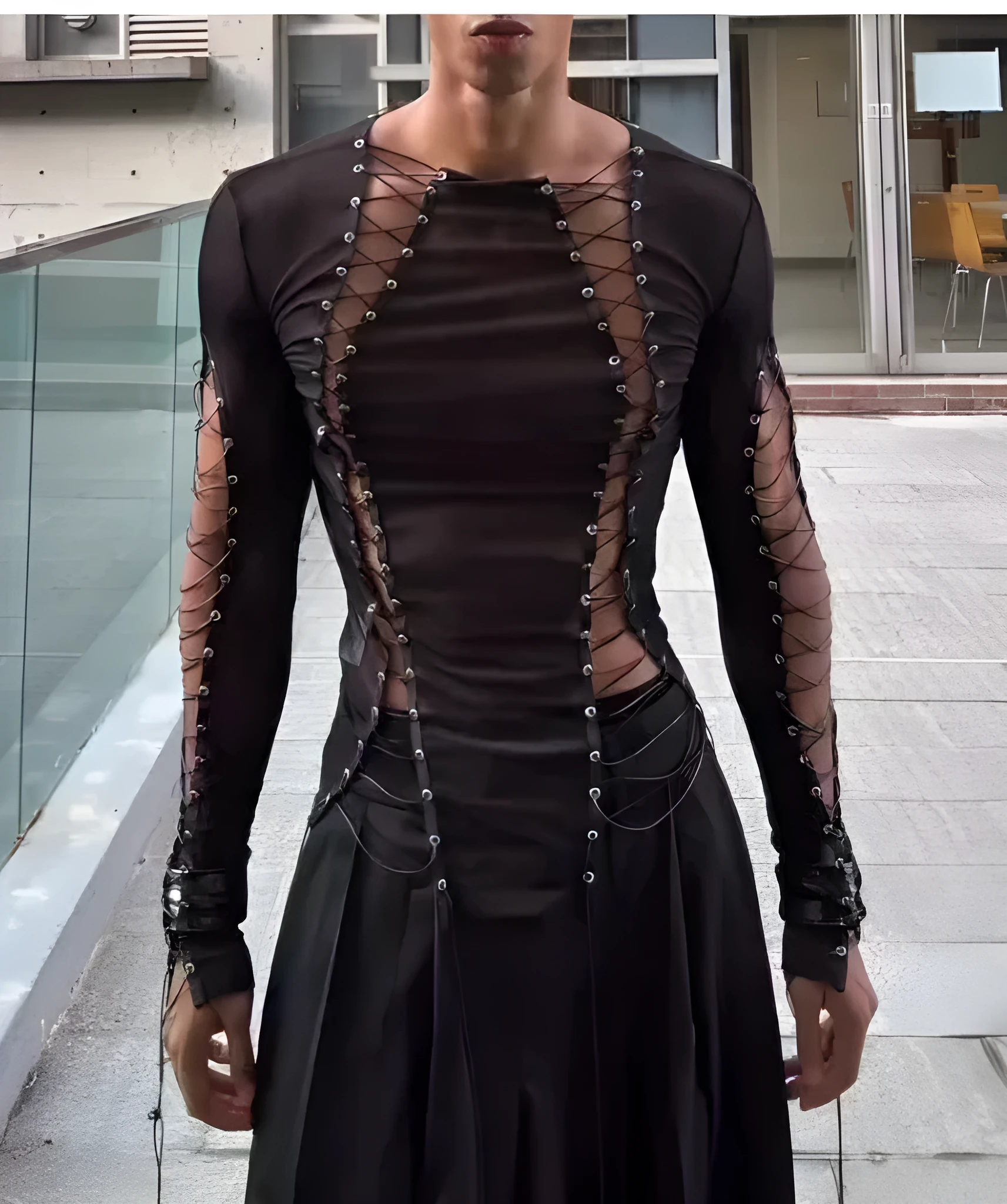 Men's black transparent lace-up mesh top with long sleeves and drawstring hem worn on a model
