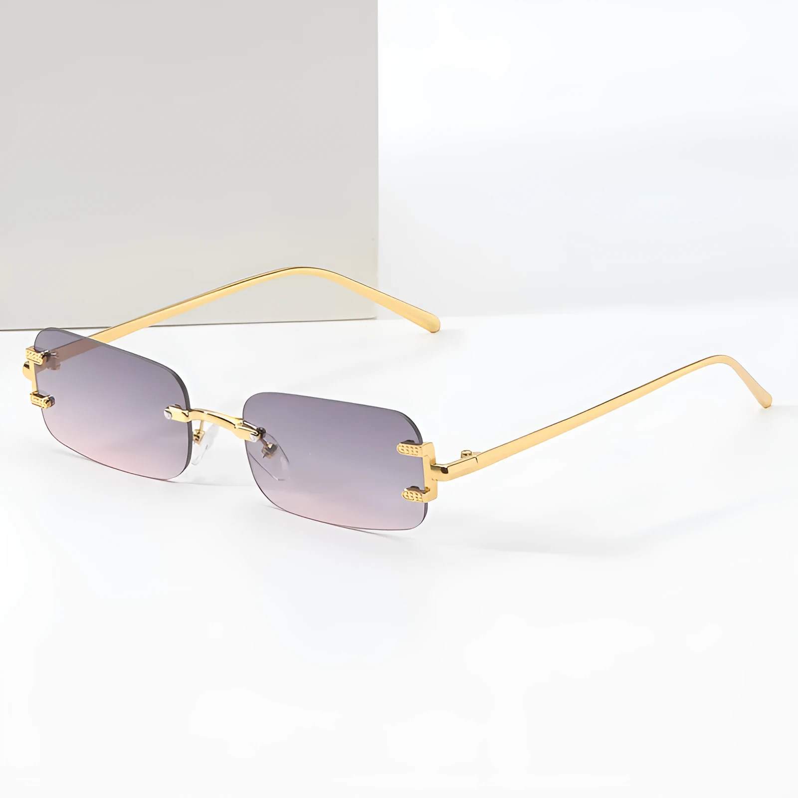 Retro square frameless sunglasses with gold metal frame and black/grey AC lenses