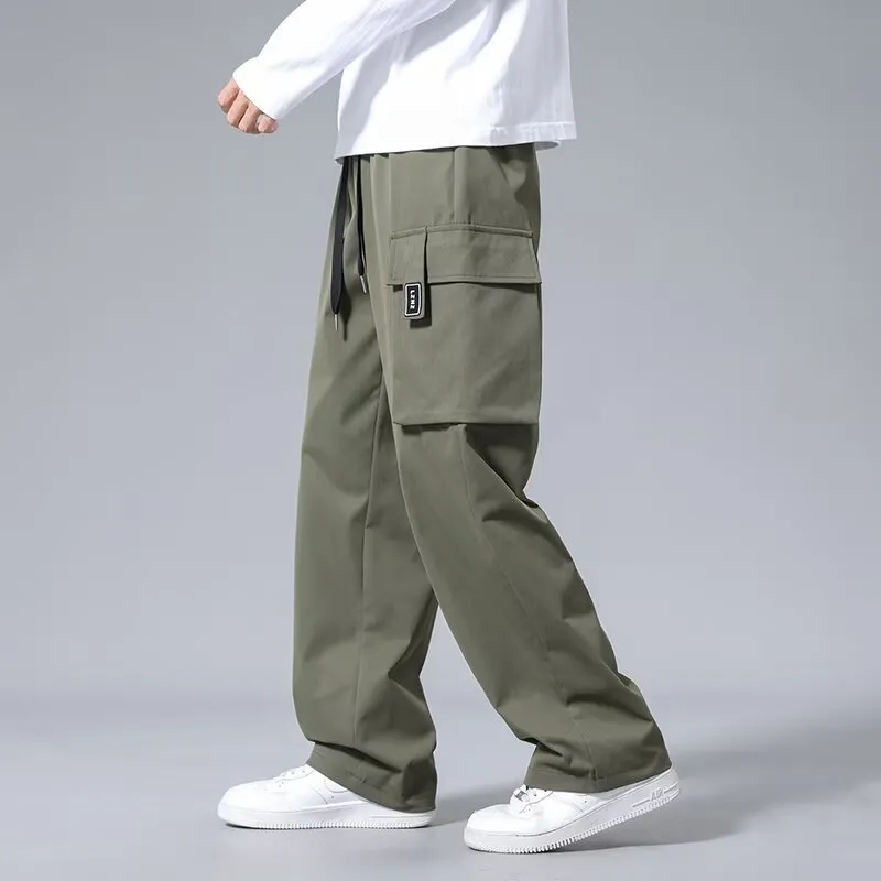 Boys' straight leg cargo trousers in army green with large cargo pockets and a drawstring waistband.