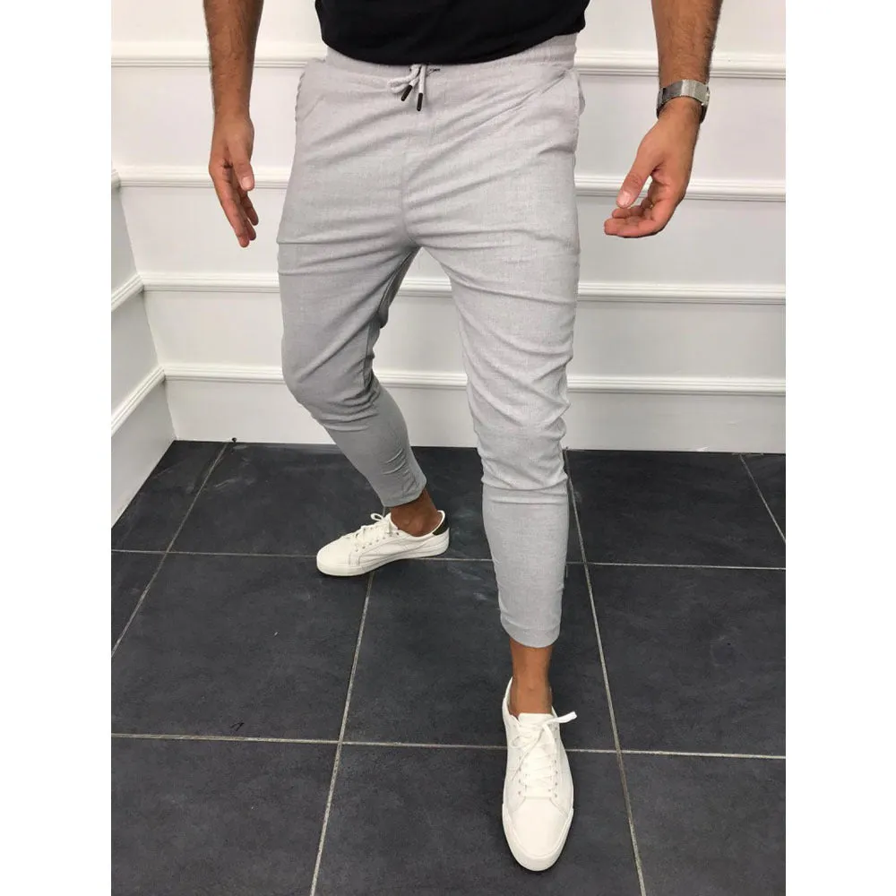 Lace-up casual jogging pants in solid light grey, nine points length, mid-waist, with adjustable front laces